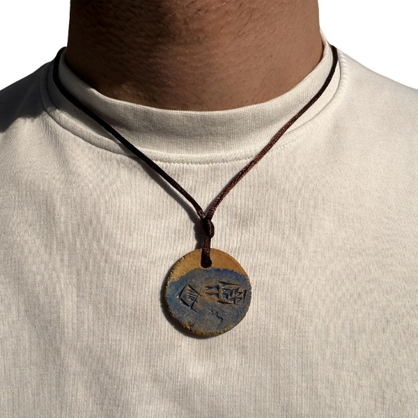 A Handcrafted Circular Pendant Featuring Delicate Sumerian Love Script, a Unique and Culturally Significant Piece of Local Artistry